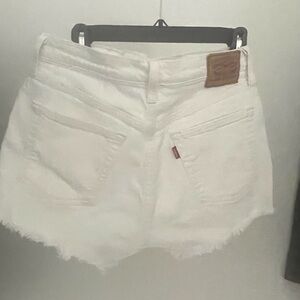 Cream color Levi fringe shorts